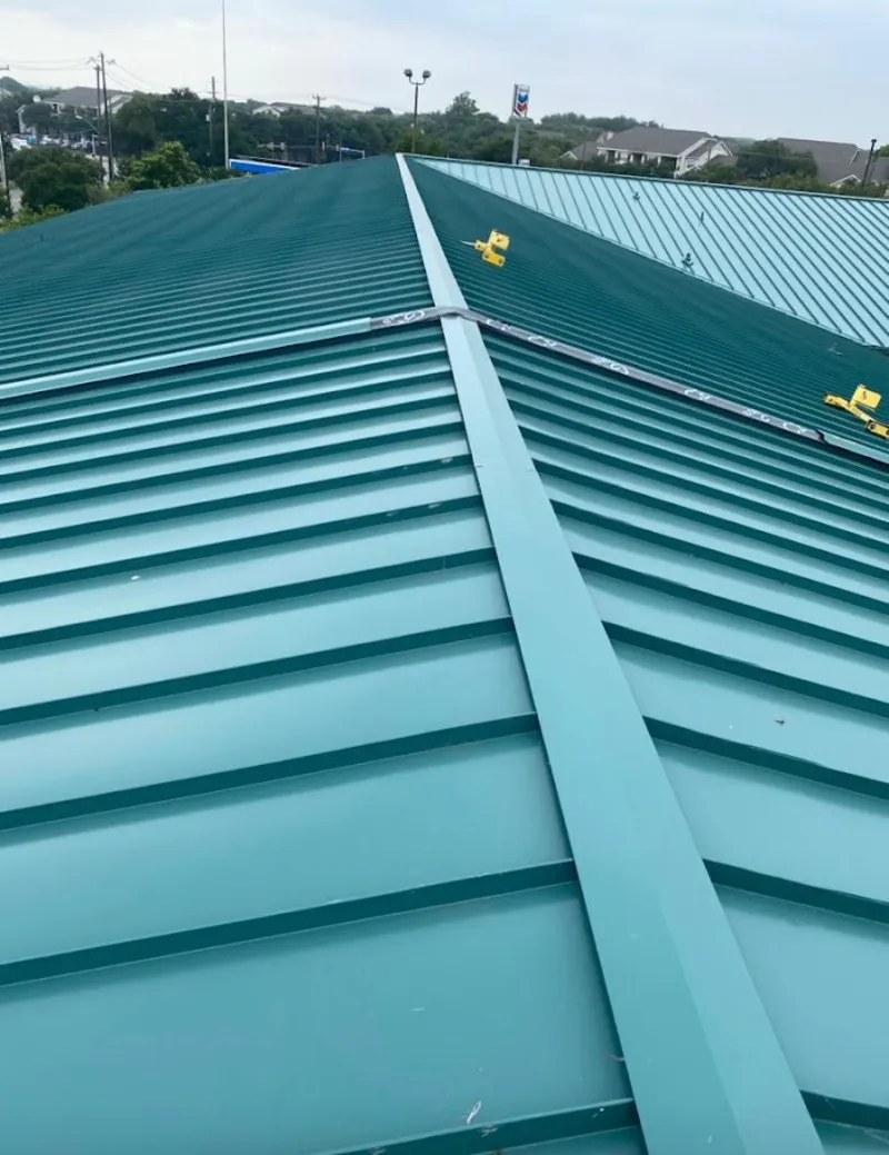 Green commercial metal roof ridge and valley for Metal Roof Repair in Pryor Creek