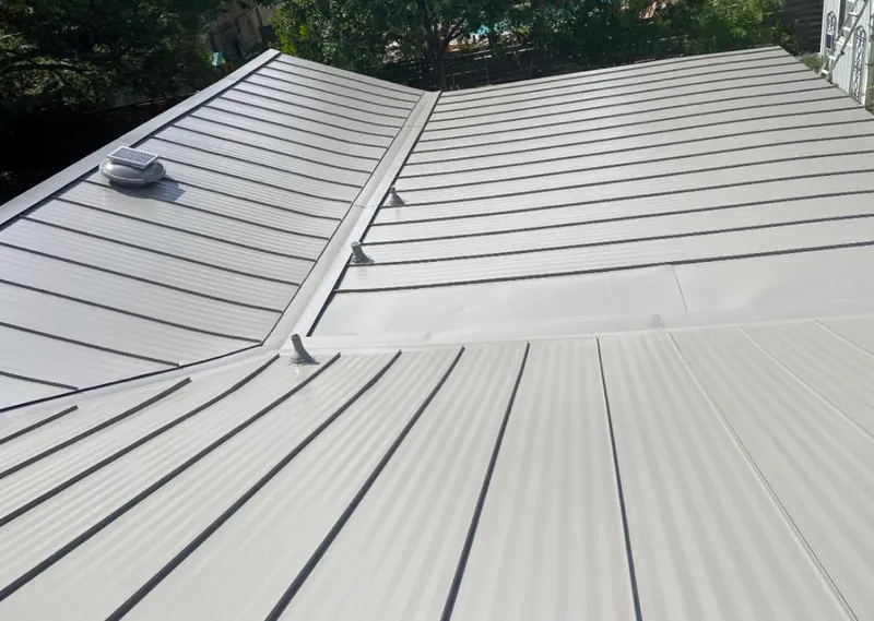 Solar attic fan installed on a metal roof for Roof Ventilation in Pryor Creek
